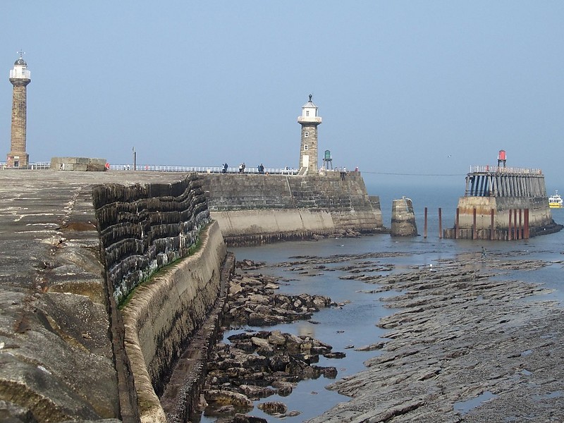 Whitby harbour lighthouses
Left stone tower: Whitby West Pier old lighthouse 
Left sceletal tower with lantern: Whitby West Pier light
Right stone tower: Whitby East Pier old lighthouse 
Right sceletal tower with lantern: Whitby East Pier light
Author of the photo: [url=http://www.flickr.com/photos/69256737@N00/]Richard Barron[/url]
Keywords: Scarborough;England;North sea