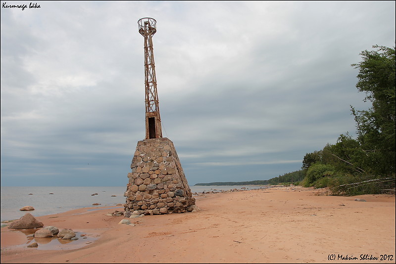 Kurmrags lighthouse
Still standing.
After repeated requests of local fishermen, a lighthouse was built in the headland of Kurmrags in 1923 as the landmark location between the ports of Ainazhi and Riga. Originally, it stood in the meadow next to the steep slope of the coastline. During a tornado in 1967, the lighthouse was destroyed and the light was turned off. The next tornado in 2005 flushed the lighthouse into the sea, leaving it all warped in the sea couple of metres away from the shore. The ?urmrags lighthouse is popularly styled as the Smugglers Lighthouse, and the near bay ?? as the Smugglers Bay, because at the early 1920s it was one of the nearby coastal channels for supplying cheap alcohol from Estonia to Latvia.
 Located at the village of ?urmrags on the east coast of the Gulf of R?ga about 40 km (25 mi) south of Aina??i. 
Keywords: Latvia;Gulf of Riga;vidzeme
